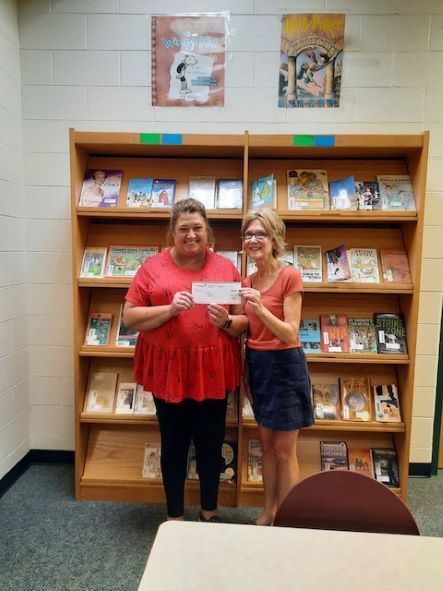 Mrs. Lyles donating $100.00 to Parkside.